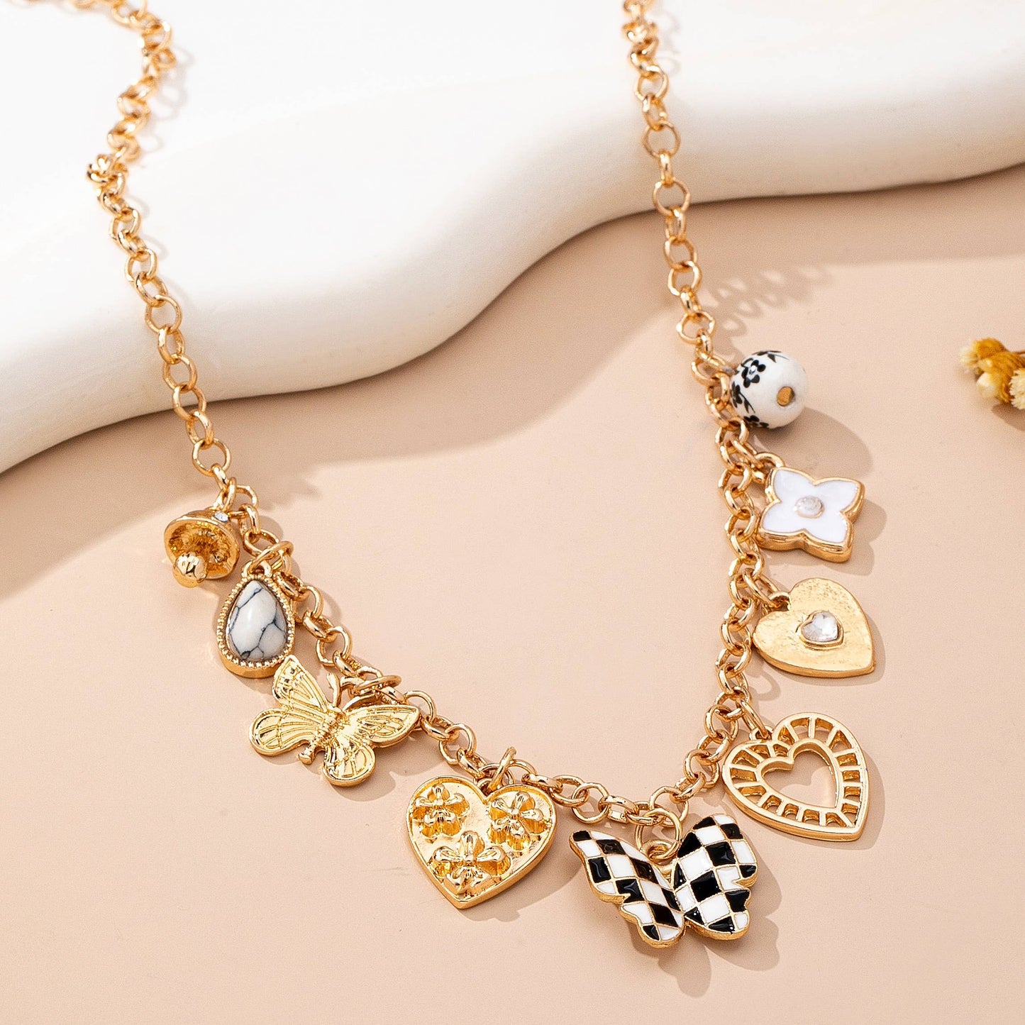 Gold Charm Necklace with Hearts Butterflies and Pearls | Checkered Floral Statement Necklace