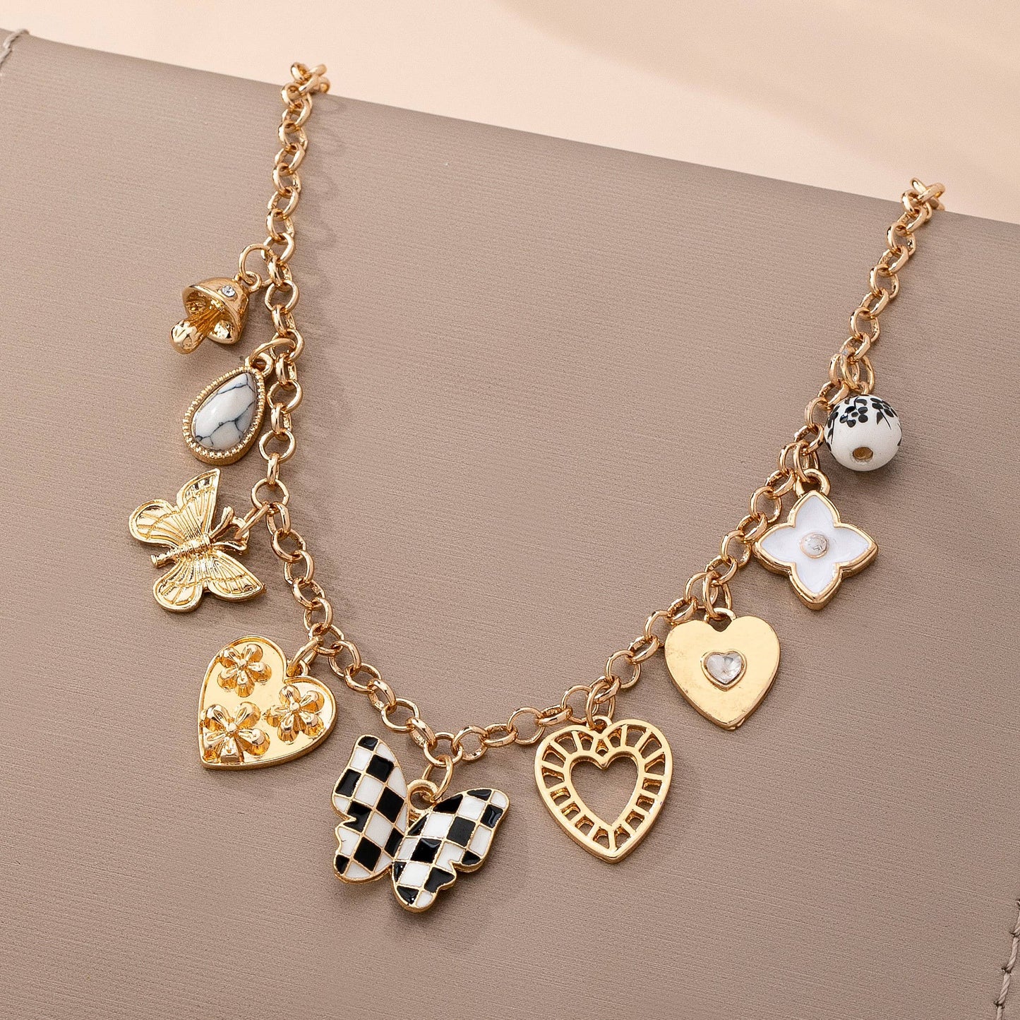 Gold Charm Necklace with Hearts Butterflies and Pearls | Checkered Floral Statement Necklace