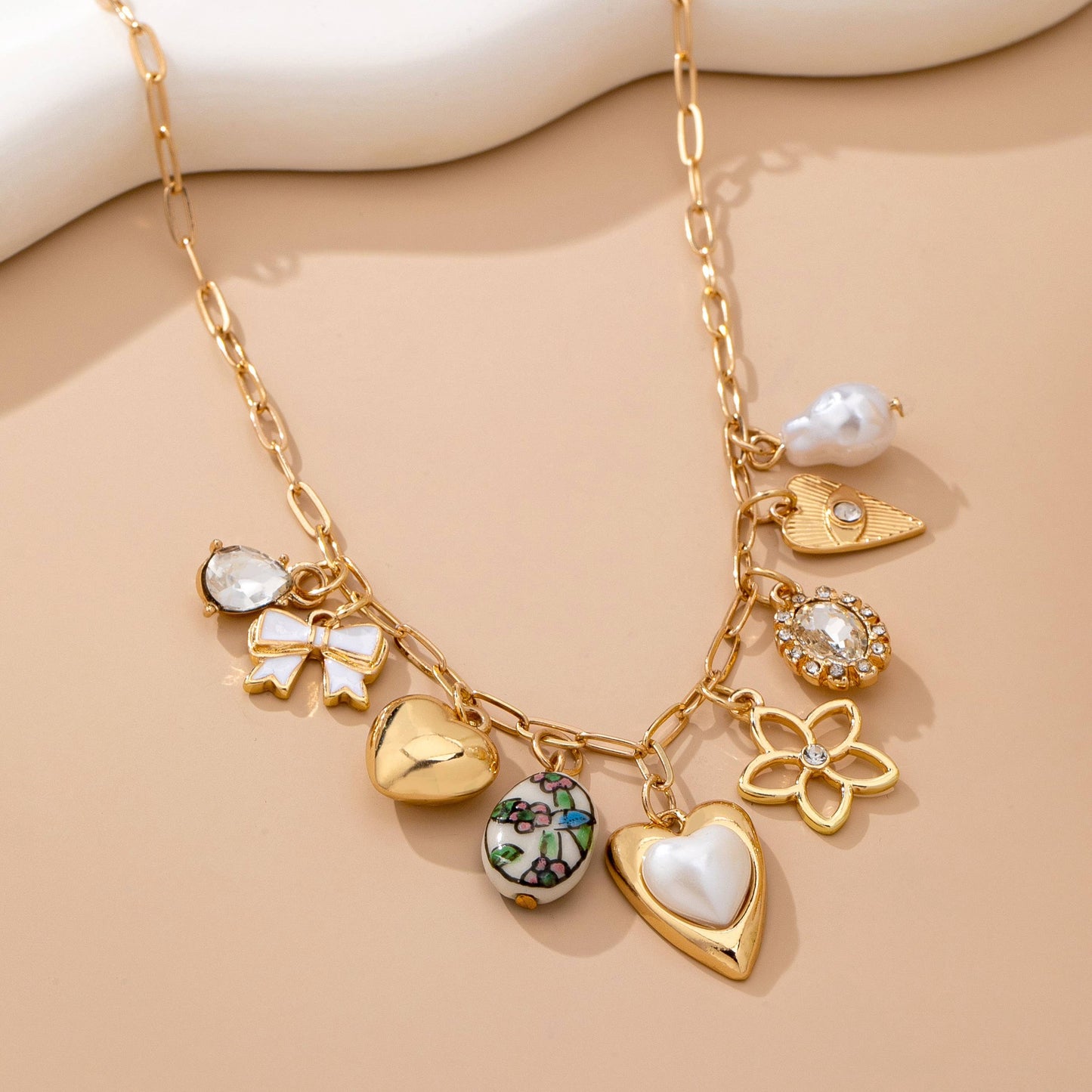 Gold Heart Charm Necklace with Pearls and Crystals | Romantic Multi Charm Statement Necklace
