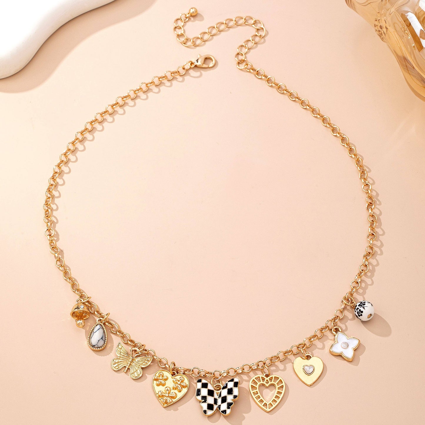 Gold Charm Necklace with Hearts Butterflies and Pearls | Checkered Floral Statement Necklace