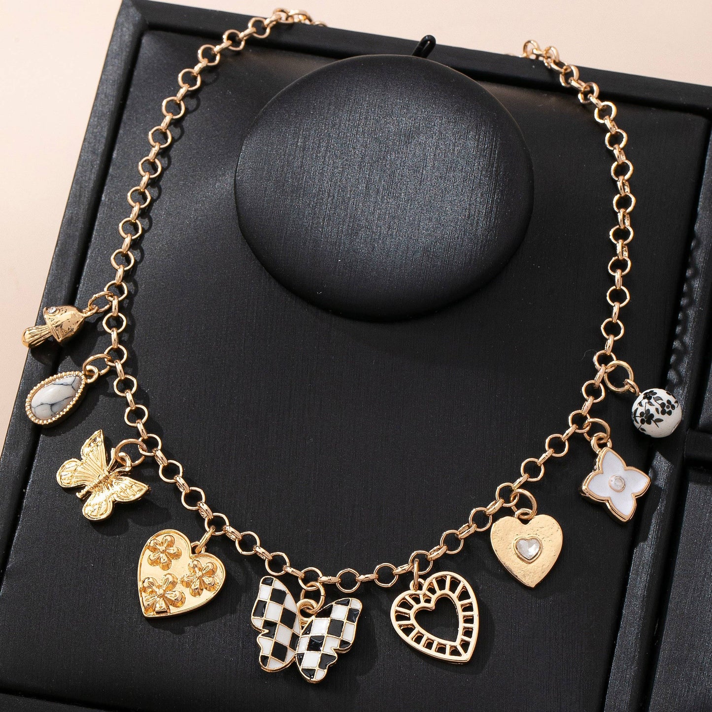 Gold Charm Necklace with Hearts Butterflies and Pearls | Checkered Floral Statement Necklace
