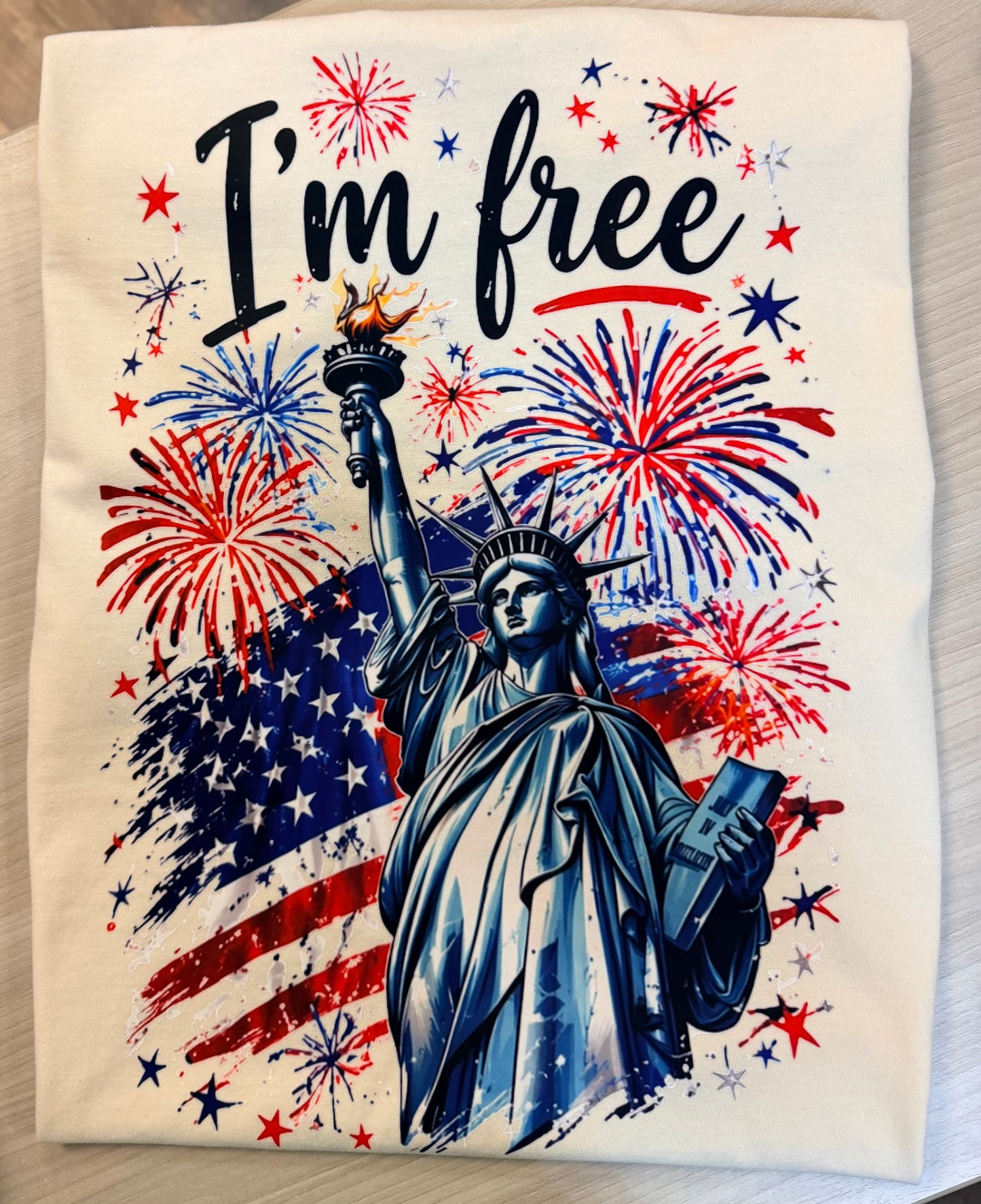 Where At Least I Know I’m Free Patriotic Tee | Comfort Colors USA Flag Fireworks Shirt (Ivory & Blue Jean)