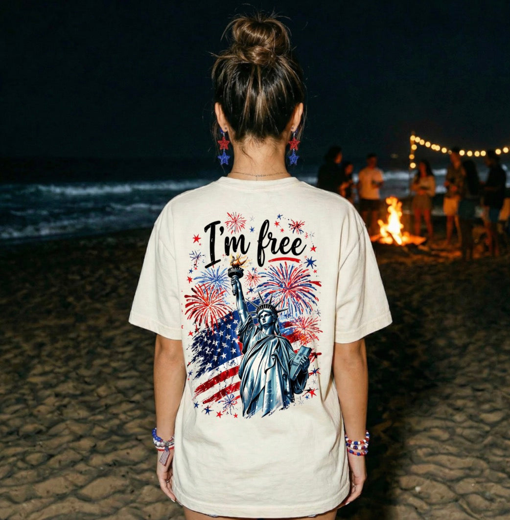 Where At Least I Know I’m Free Patriotic Tee | Comfort Colors USA Flag Fireworks Shirt (Ivory & Blue Jean)