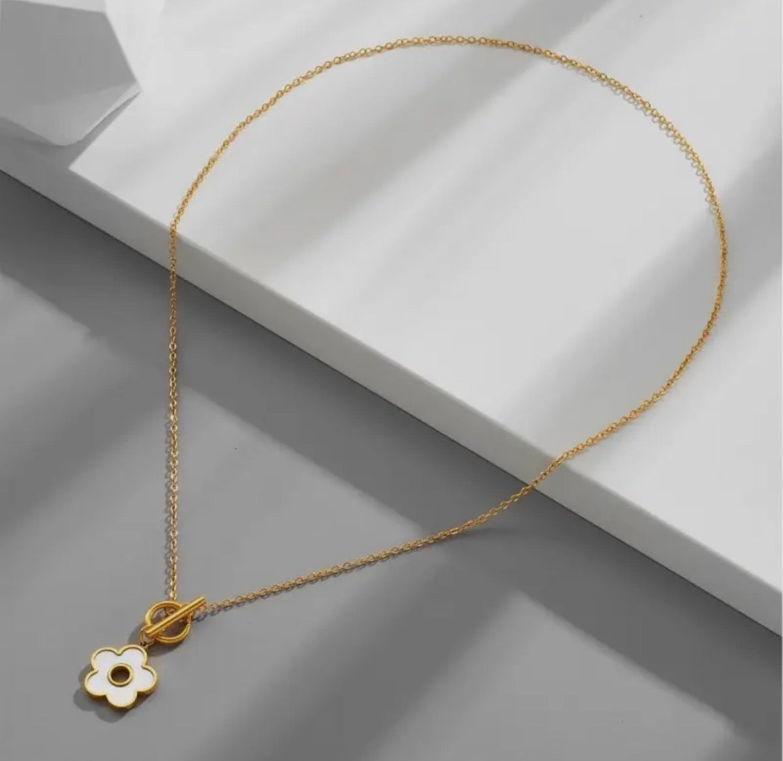 Pearlized White Floral Toggle Necklace in gold