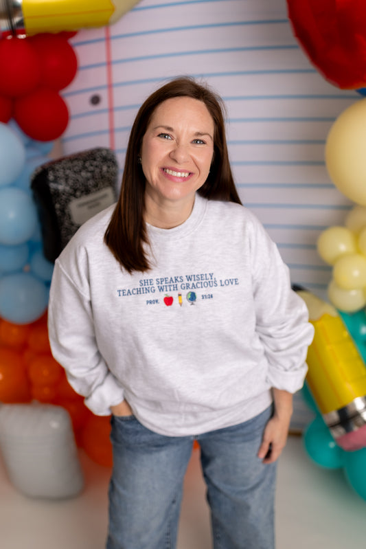 She Speaks Wisely Embroidered Teacher Crewneck Sweatshirt | Gildan Heavy Blend Ash Grey