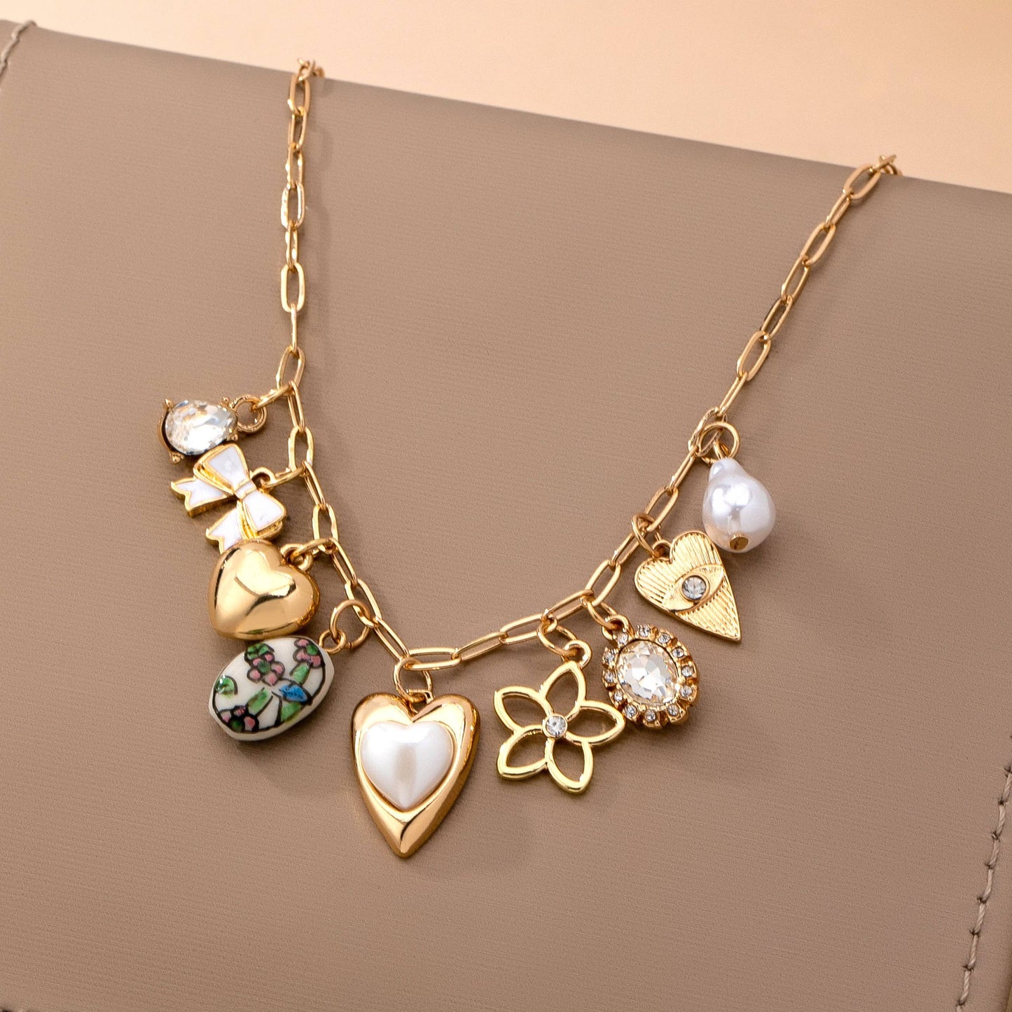 Gold Heart Charm Necklace with Pearls and Crystals | Romantic Multi Charm Statement Necklace