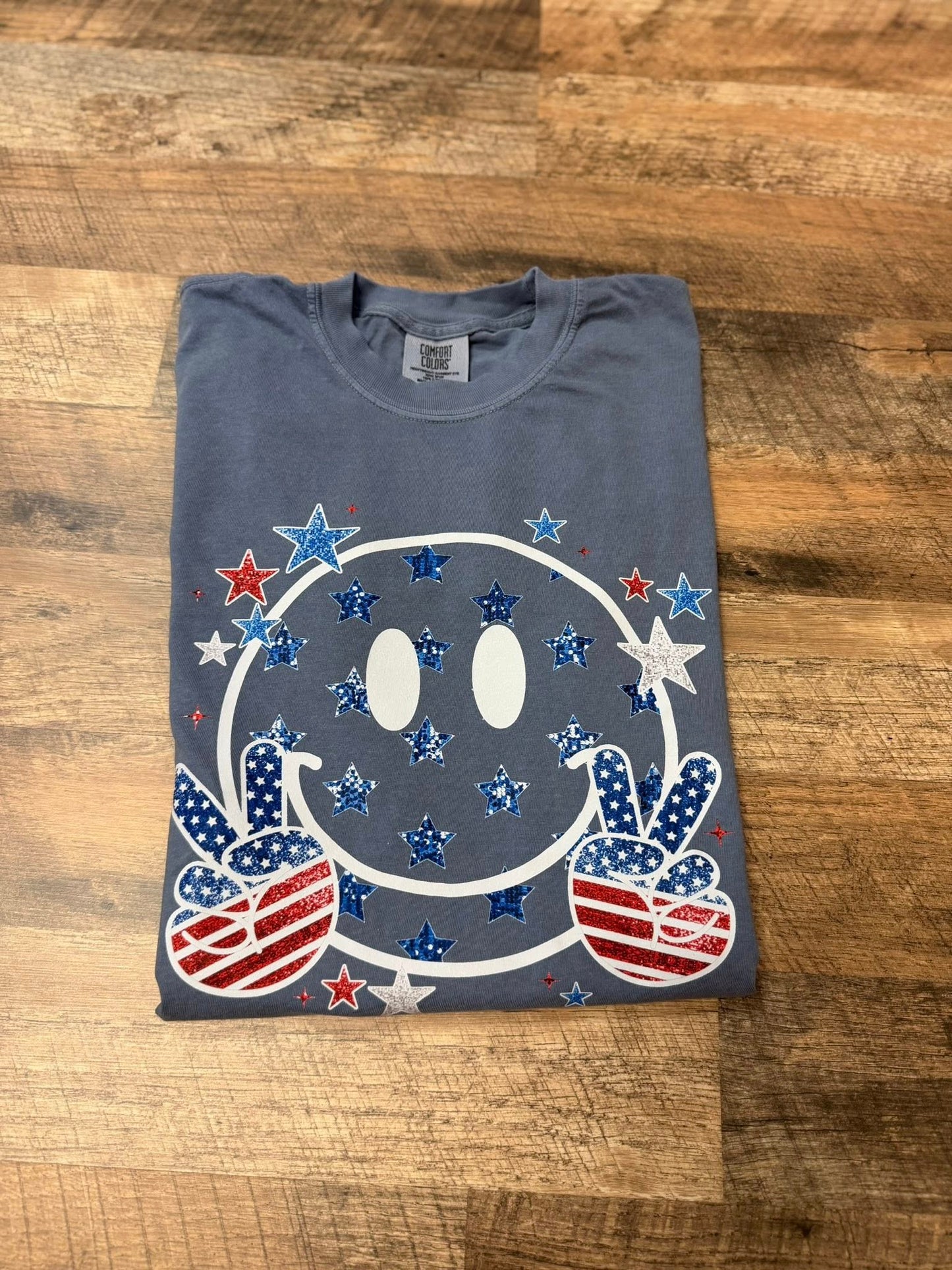 Comfort Colors Black Smiley Face Tee – Patriotic Peace Sign